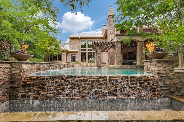 view of swimming pool with a pergola