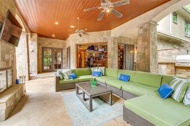 living room featuring french doors, ceiling fan, concrete floors, and wood ceiling