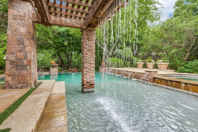 view of swimming pool with a pergola and pool water feature