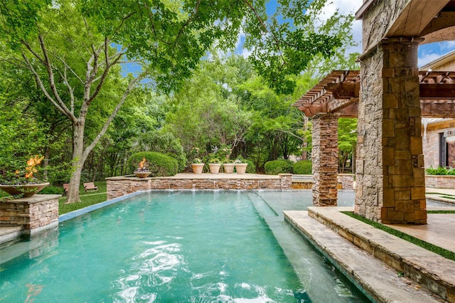 view of swimming pool with pool water feature