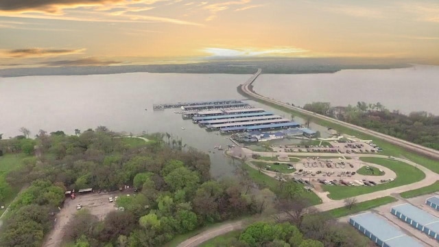 aerial view at dusk with a water view