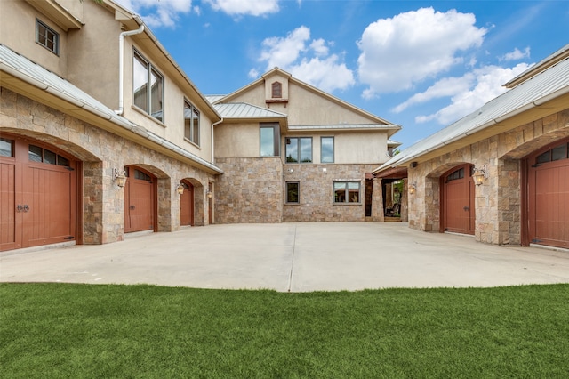 exterior space featuring a garage and a front lawn