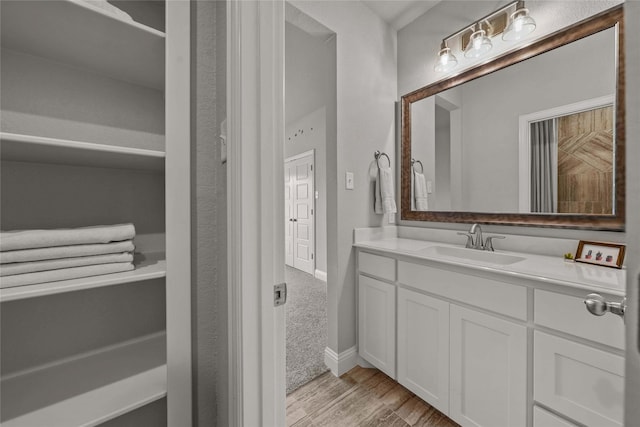 bathroom featuring vanity and hardwood / wood-style flooring