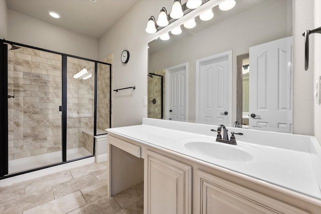 bathroom featuring vanity and walk in shower