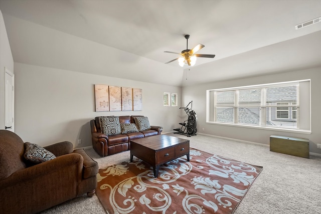 living room featuring lofted ceiling, ceiling fan, and carpet floors