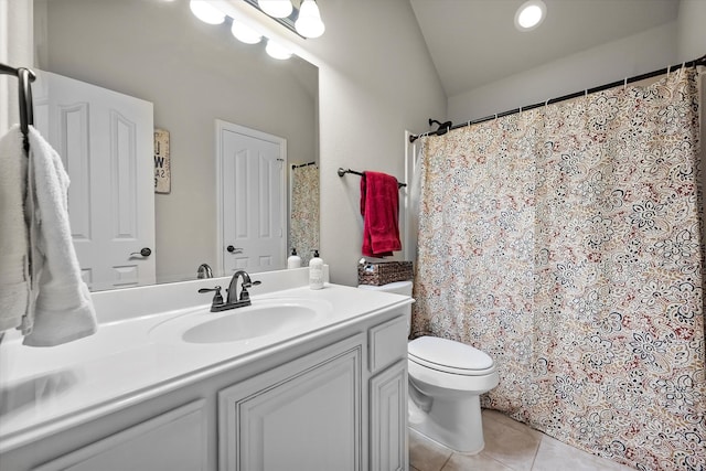 bathroom featuring toilet, tile patterned floors, vanity, vaulted ceiling, and a shower with curtain