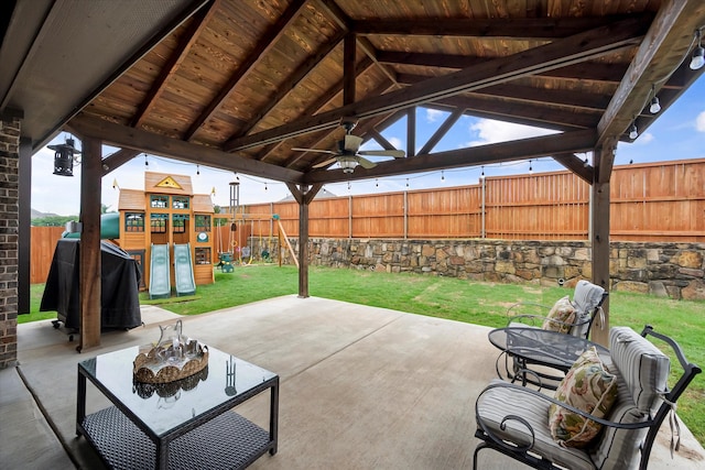 view of patio with a playground, ceiling fan, and a gazebo