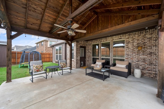 view of patio / terrace featuring ceiling fan, an outdoor hangout area, and a trampoline