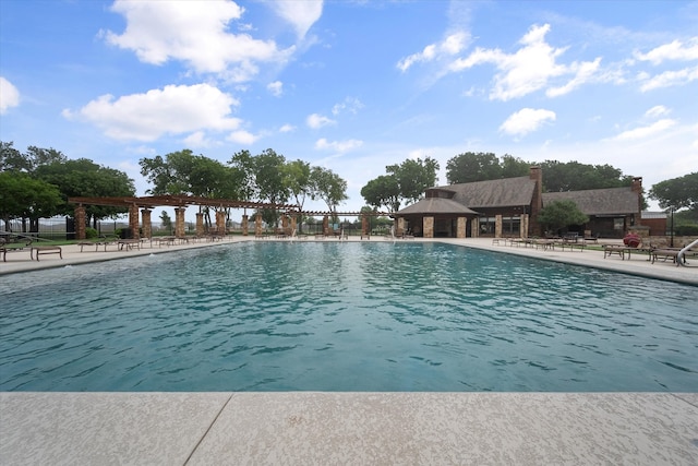 view of swimming pool featuring a patio area