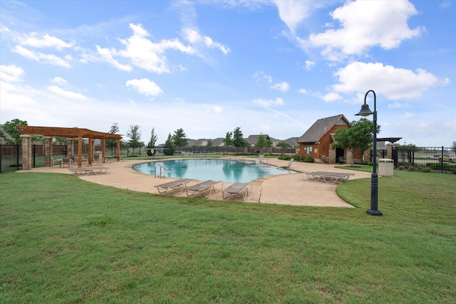 view of swimming pool featuring a yard and a patio area