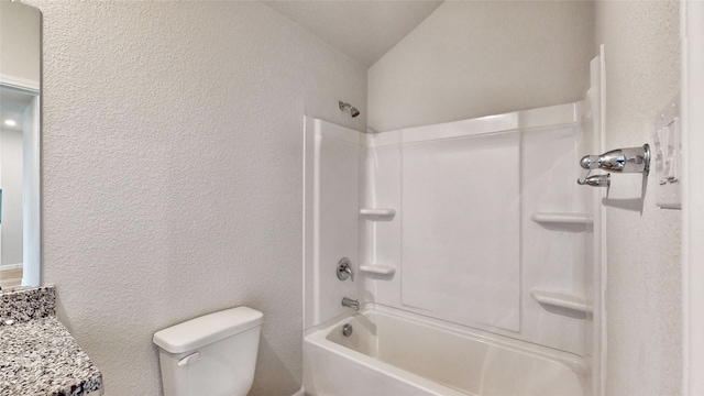 full bathroom with vanity, lofted ceiling, toilet, and washtub / shower combination