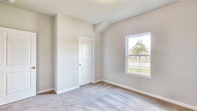 unfurnished bedroom featuring light carpet