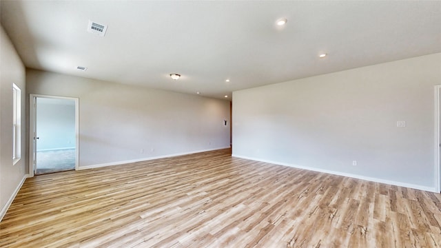 spare room featuring light wood-type flooring