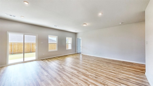 unfurnished room with light hardwood / wood-style flooring