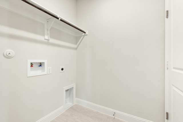 laundry room with washer hookup, hookup for a gas dryer, electric dryer hookup, laundry area, and baseboards