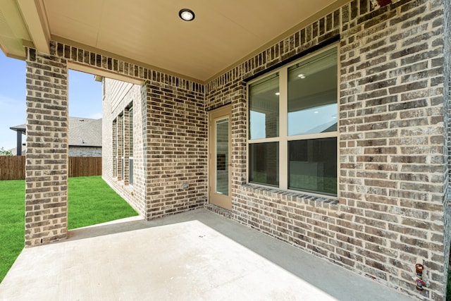 view of patio / terrace featuring fence