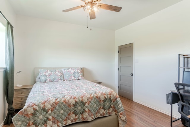 bedroom with ceiling fan and hardwood / wood-style floors