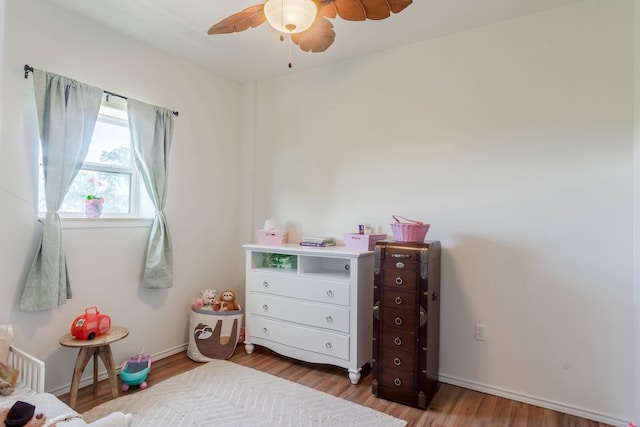 interior space with hardwood / wood-style flooring and ceiling fan