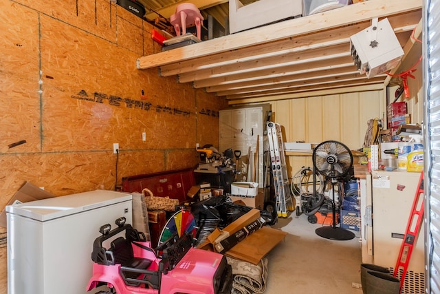 basement featuring fridge