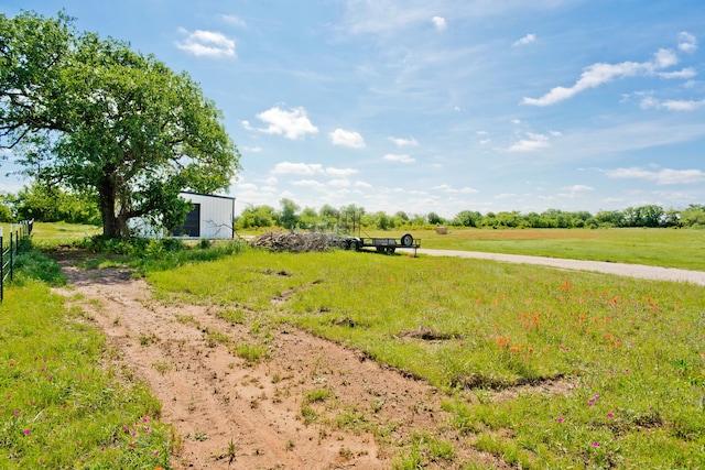 view of yard with a rural view