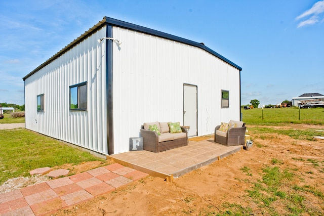 view of shed / structure with a yard and an outdoor living space