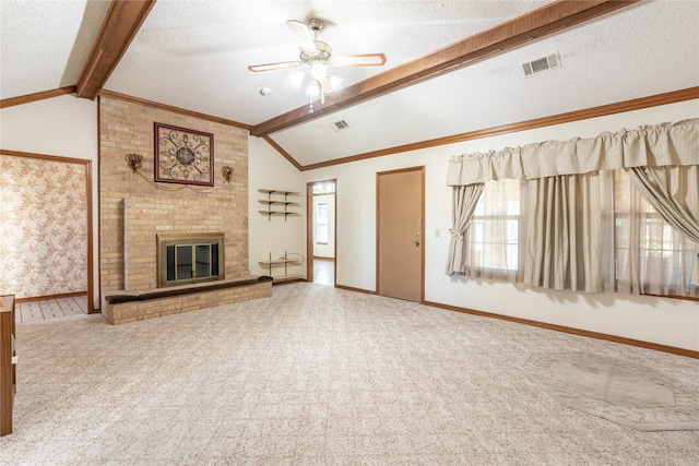 unfurnished living room featuring carpet, lofted ceiling with beams, a fireplace, and a textured ceiling