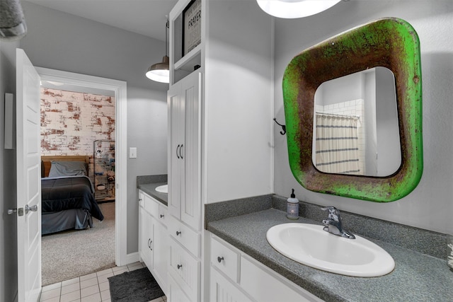 bathroom with tile floors and vanity