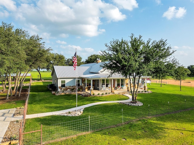 view of front of property with covered porch and a front yard