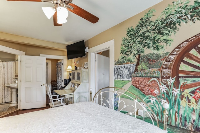 bedroom featuring wood-type flooring, ceiling fan, and ensuite bathroom