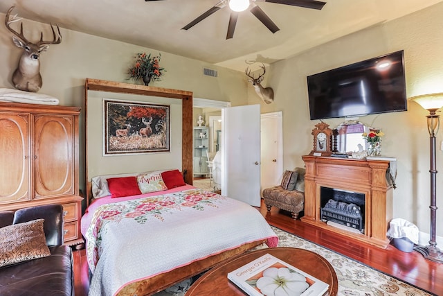 bedroom featuring ceiling fan and hardwood / wood-style floors