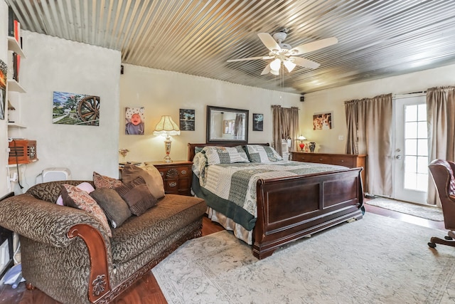 bedroom with hardwood / wood-style floors and ceiling fan