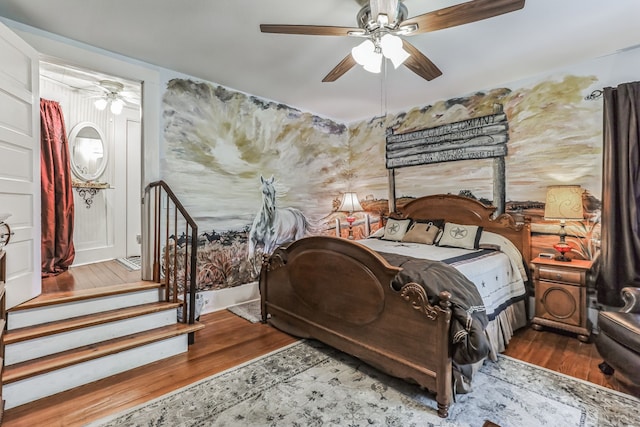 bedroom featuring ceiling fan and hardwood / wood-style flooring