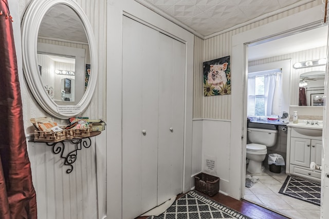 bathroom featuring ceiling fan, vanity, toilet, and tile flooring