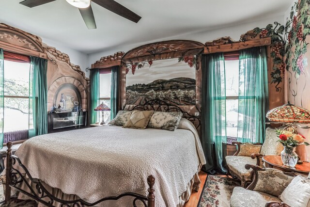 bedroom featuring ceiling fan and hardwood / wood-style flooring