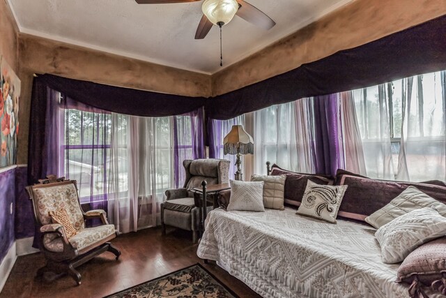 bedroom with hardwood / wood-style flooring and ceiling fan