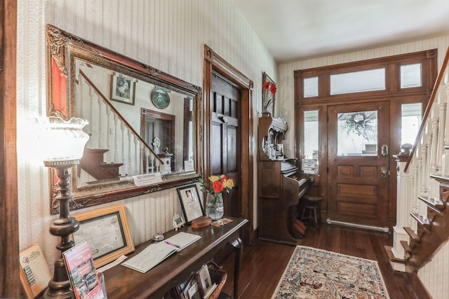 entryway with dark hardwood / wood-style flooring