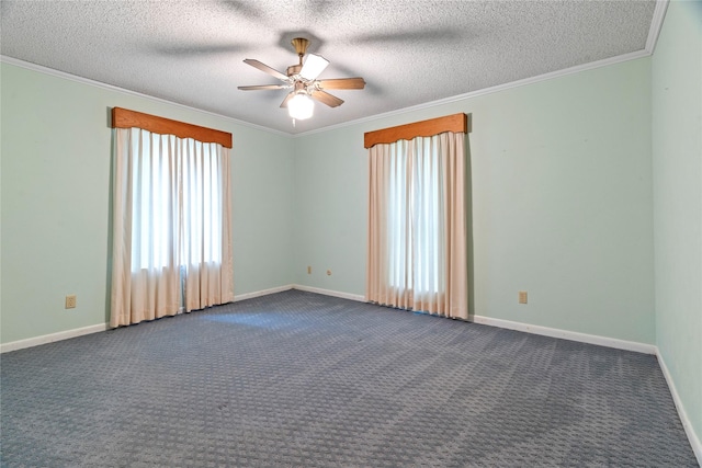 unfurnished room with a textured ceiling, dark colored carpet, a ceiling fan, and crown molding