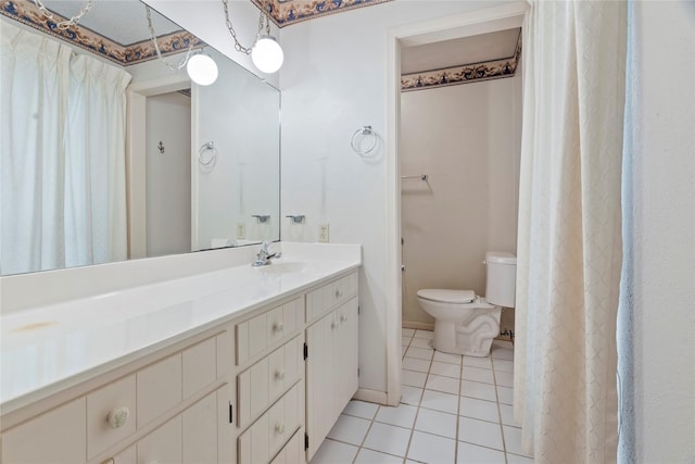 full bathroom featuring tile patterned flooring, vanity, and toilet