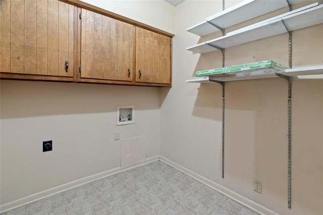 washroom with hookup for an electric dryer, washer hookup, baseboards, cabinet space, and light floors