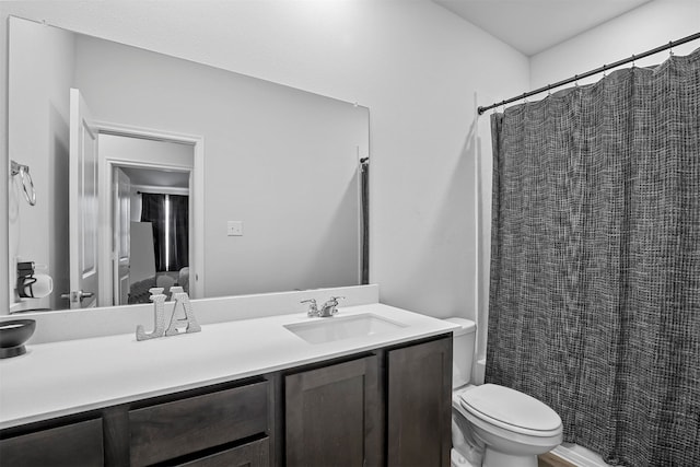 bathroom featuring large vanity and toilet