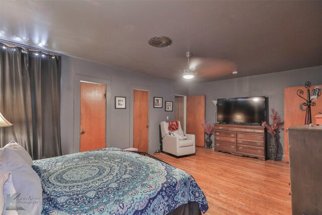 bedroom featuring ceiling fan and hardwood / wood-style flooring