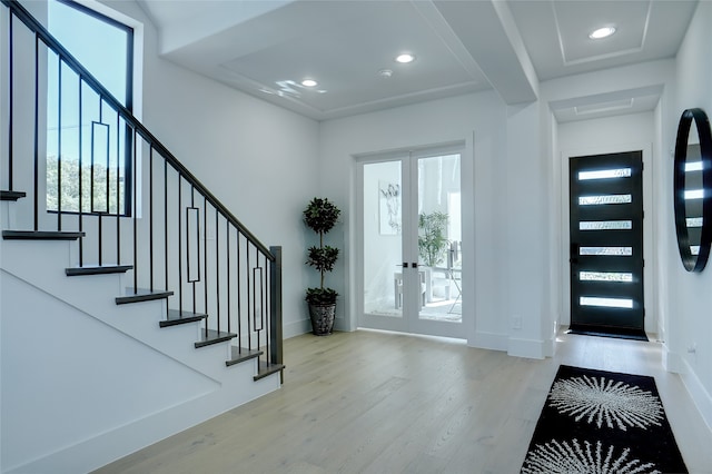 entryway featuring french doors and hardwood / wood-style floors