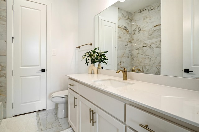 bathroom with tile flooring, large vanity, and toilet