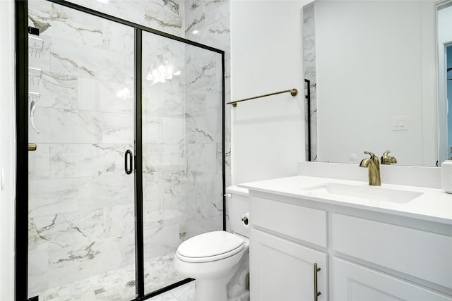 bathroom with a shower with door, vanity with extensive cabinet space, and toilet