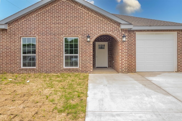 view of front facade with a garage and a front lawn