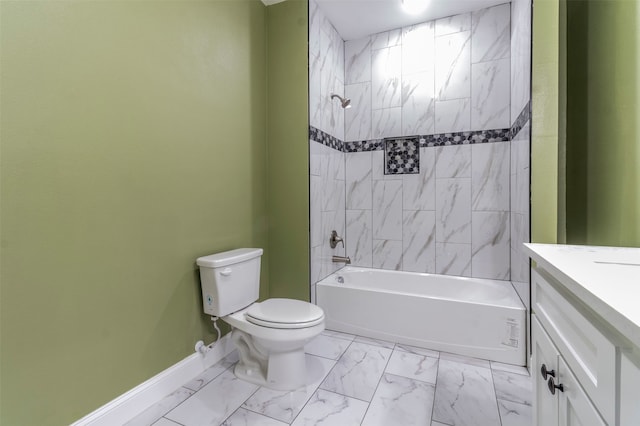 full bathroom with vanity, tile floors, toilet, and tiled shower / bath