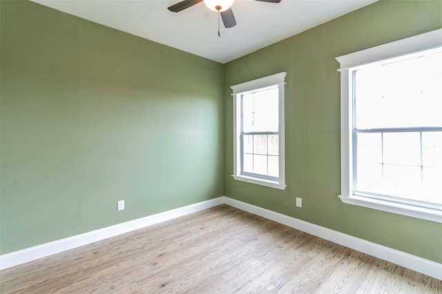 empty room featuring wood-type flooring and ceiling fan