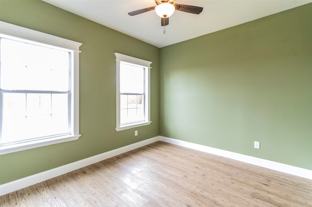 spare room featuring ceiling fan and light wood-type flooring