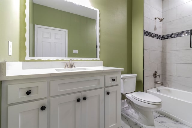 full bathroom with tile floors, tiled shower / bath, vanity, and toilet