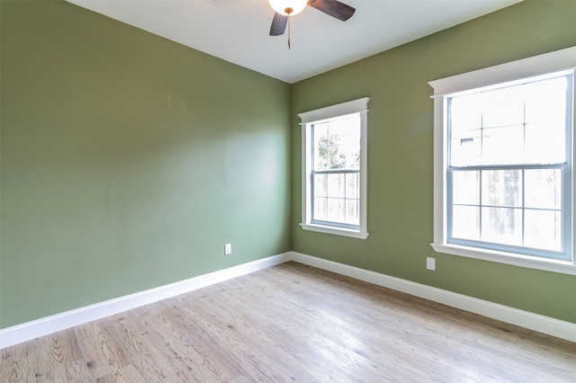 spare room with light hardwood / wood-style flooring and ceiling fan